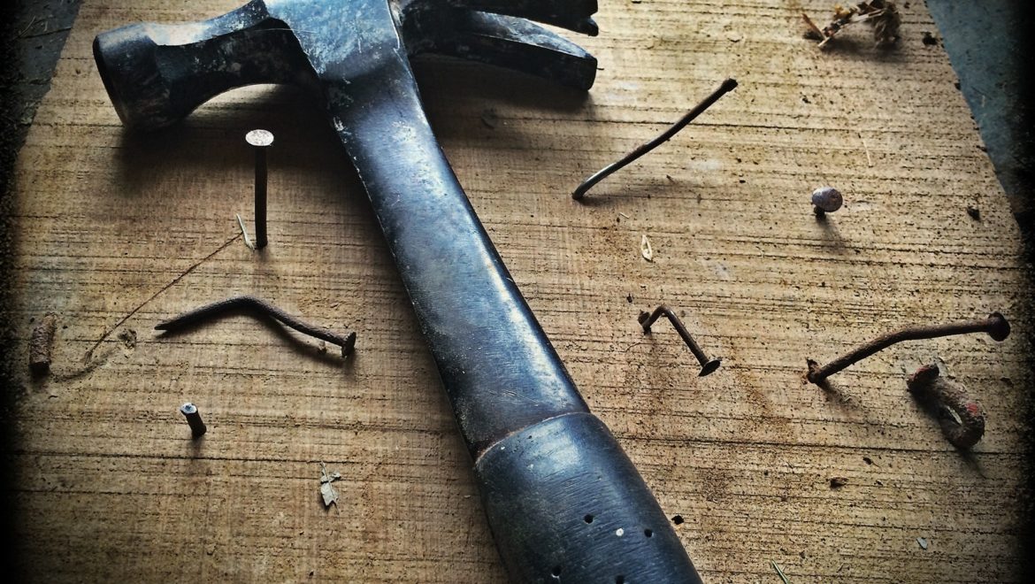 Hammer and nails in bad builder work