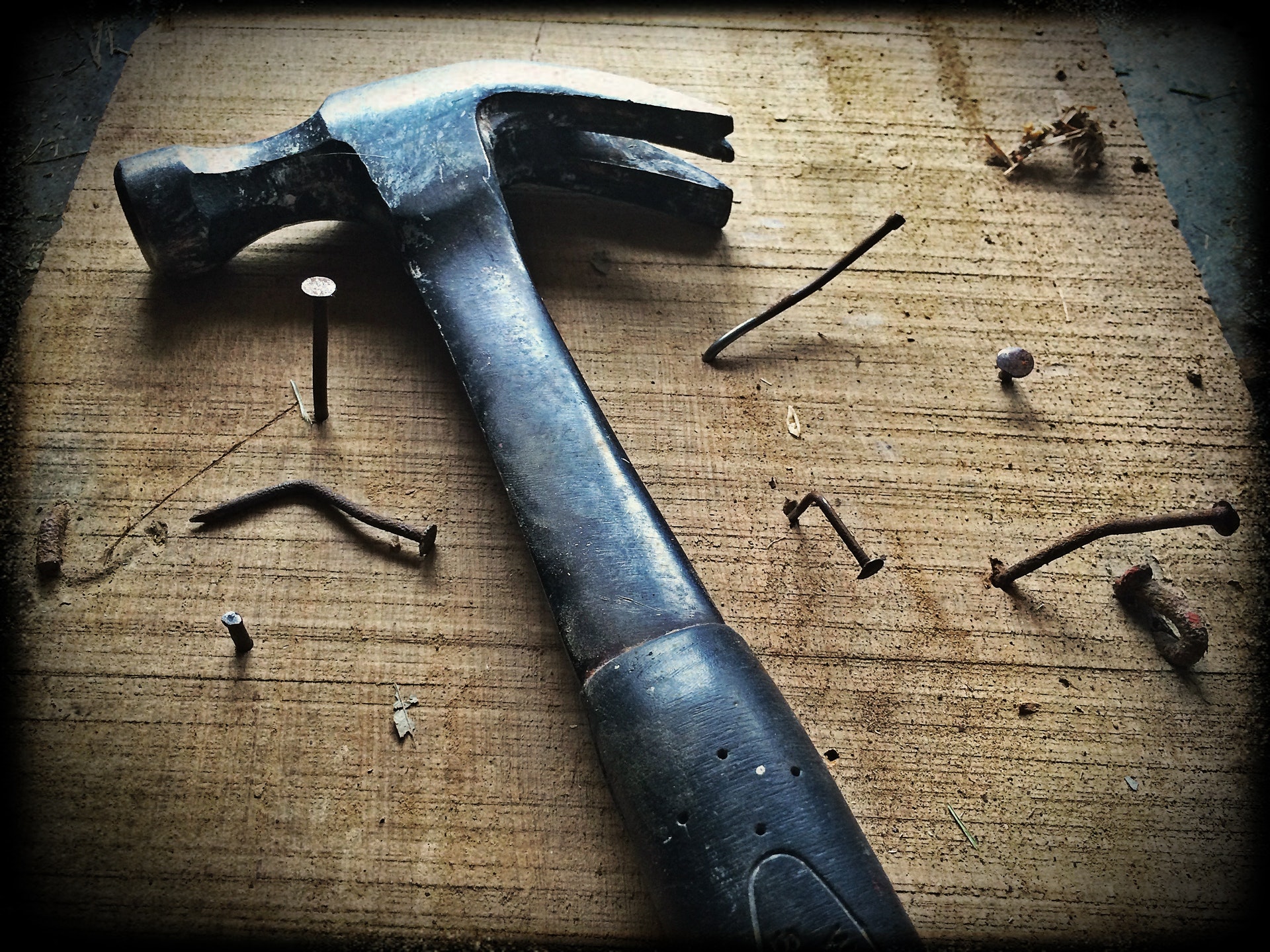 Hammer and nails in bad builder work