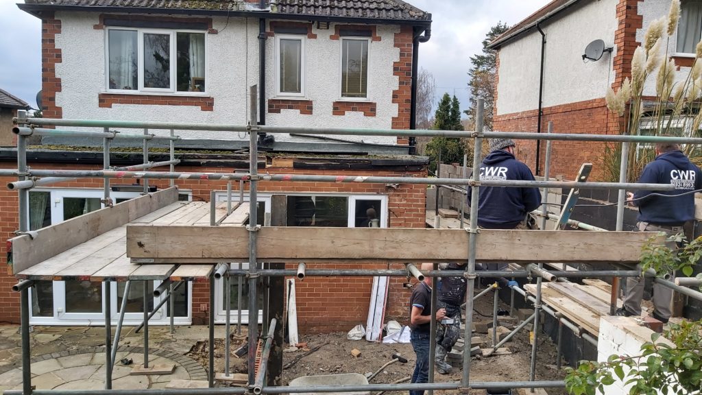 Builders working on a house extension project