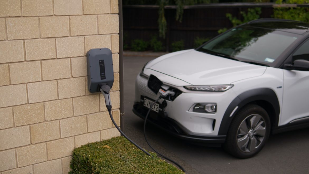 Electric car charging point fixed to wall