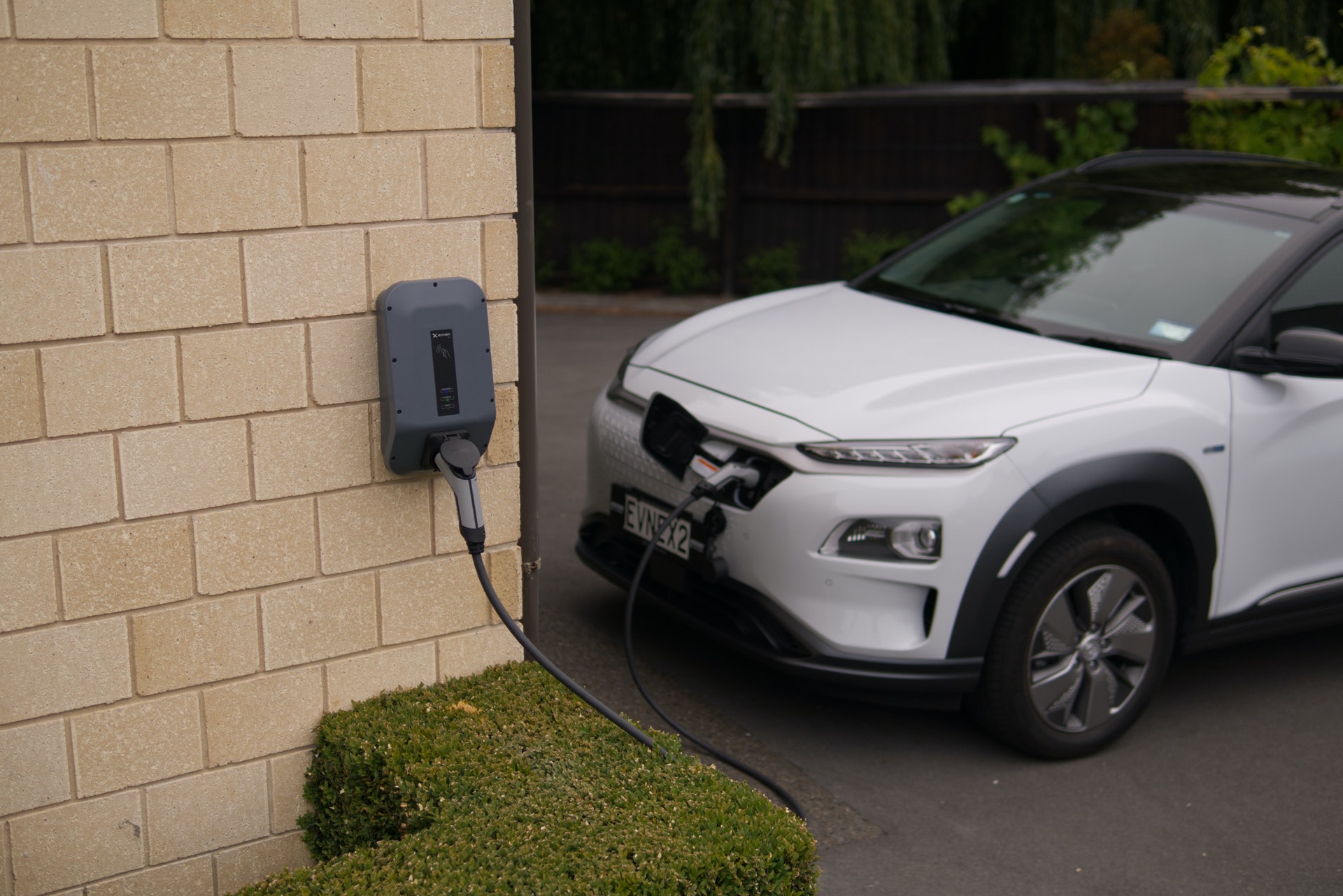 Electric car charging point fixed to wall