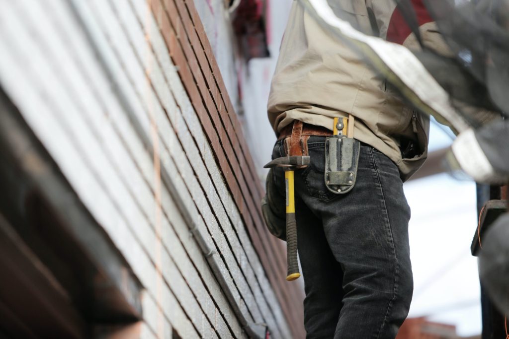 Builder showing their tool belt