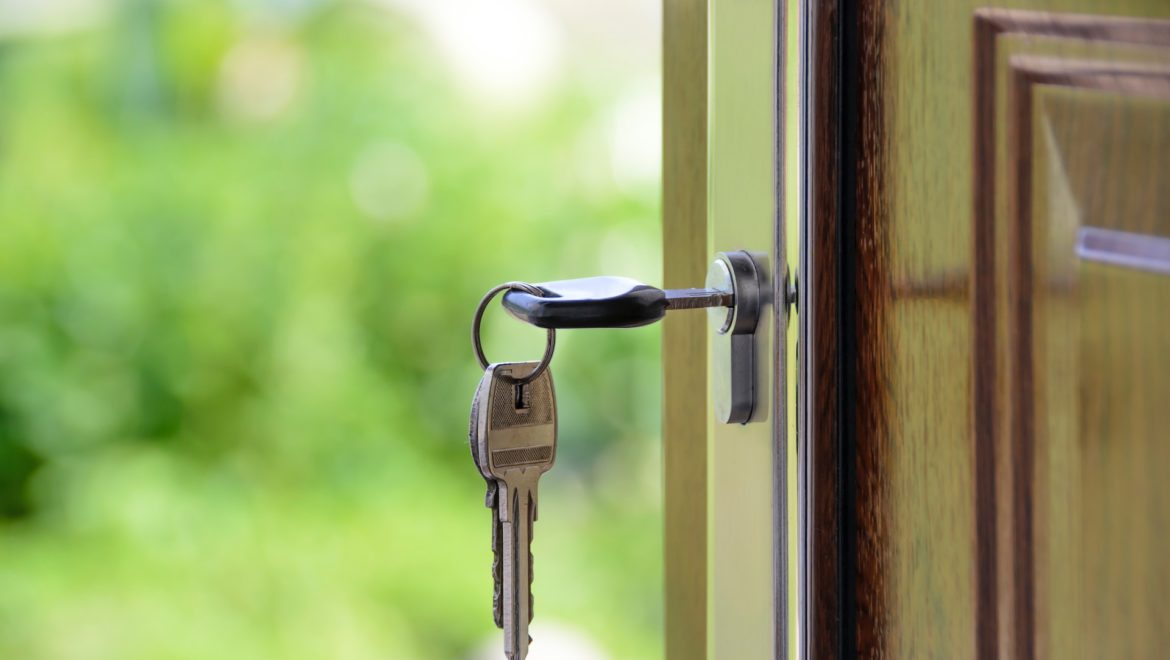 Keys in front door of new house