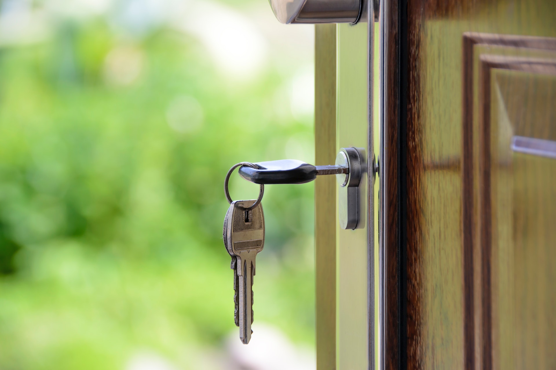 Keys in front door of new house